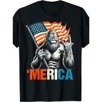 T – Shirt with a Fun Twist: Iconic Bigfoot Figure Holding Flag and Making Hand Gesture with ‘Merica’ for a Light – hearted Patriotic Vibe